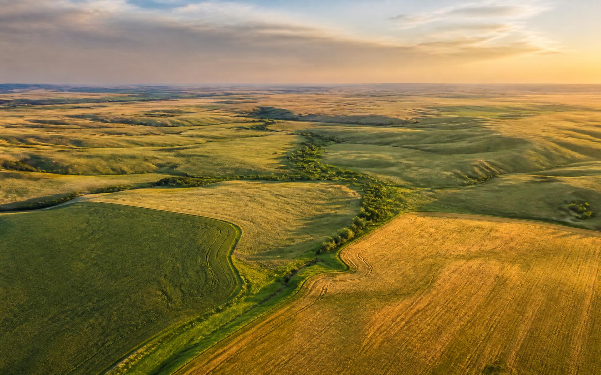 Aerial view of southeastern South Dakota farmland and prairie at golden hour